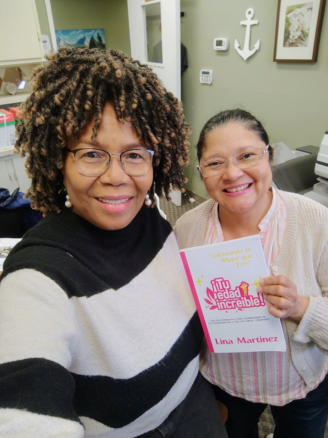 Lina Martinez with a reader holding her book (1)